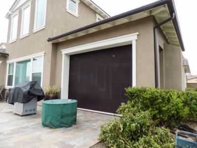 House with retractable screen door