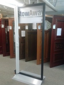 Stowaway retractable screen door