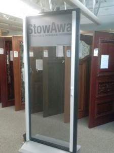 Stowaway retractable screen door