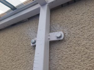 bad paint job on sloped trellis awning cover