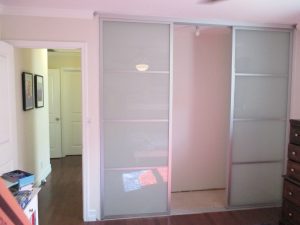 3-panel, 3-track, silver-framed Closet Doors with white laminated glass
