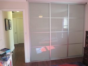 3-panel, 3-track, silver-framed Closet Doors with white laminated glass