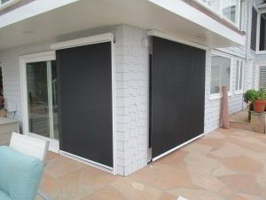 motorized sun screens on a backyard French door and sliding door
