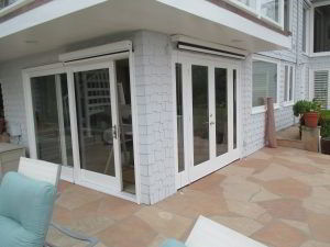 motorized sun screens on a backyard French door and sliding door