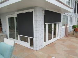 motorized sun screens on a backyard French door and sliding door