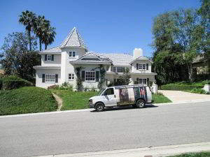 Classic Improvement Products van in front of house