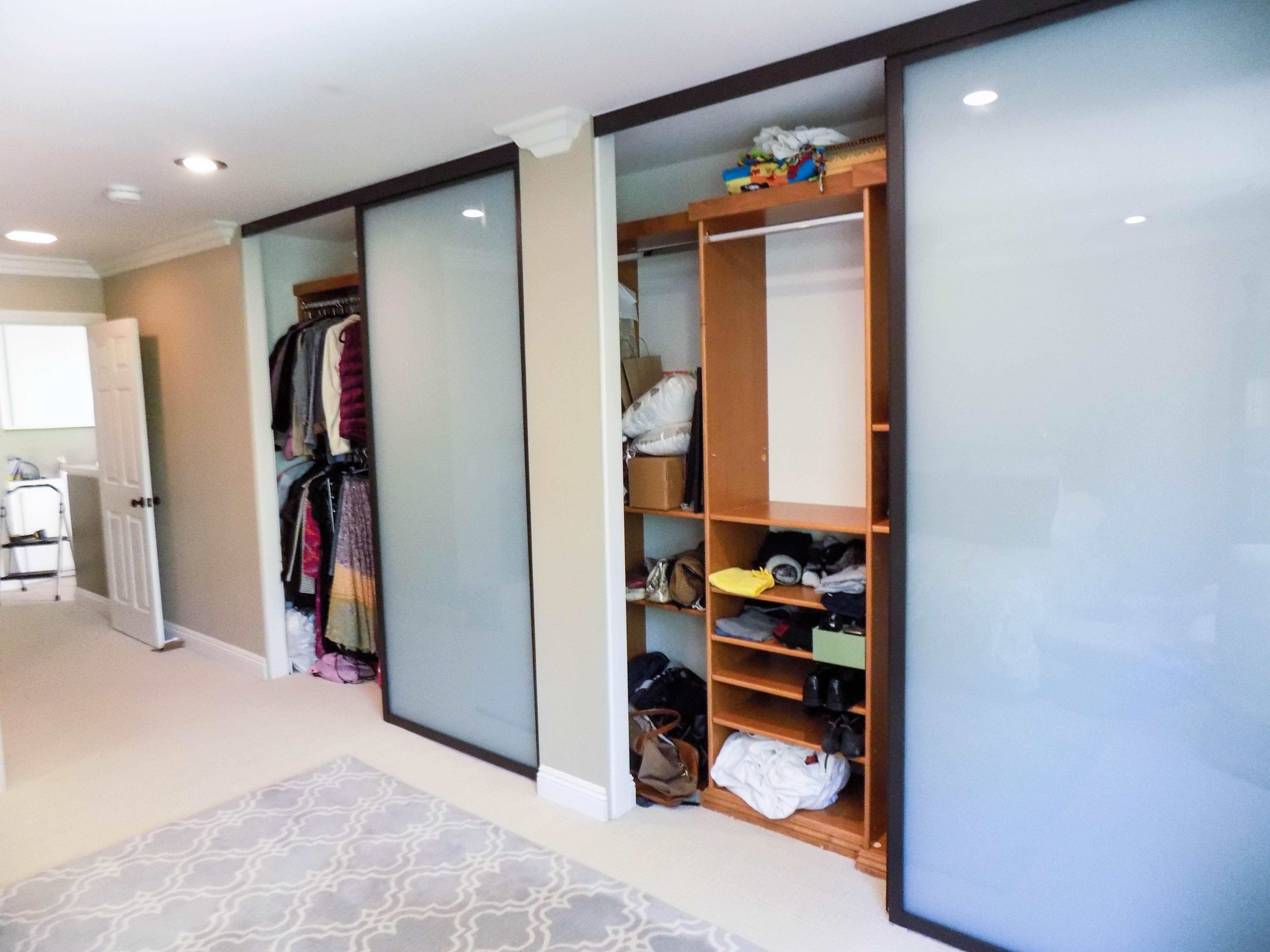 two sets of 2-track, 2-panel, top-hung Closet Doors