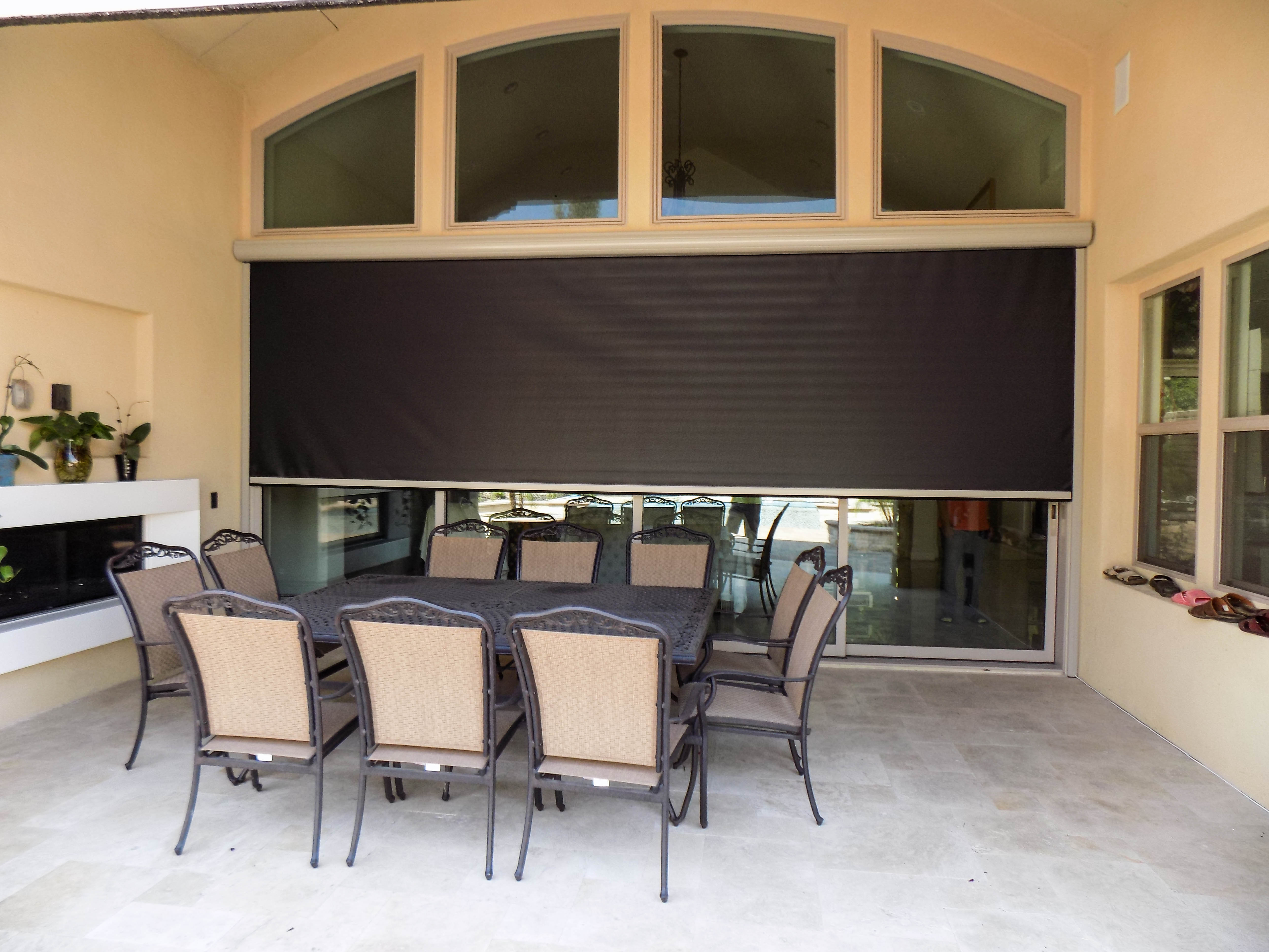 Blackout Motorized Power Screen with black mesh on the outside and white mesh on the inside