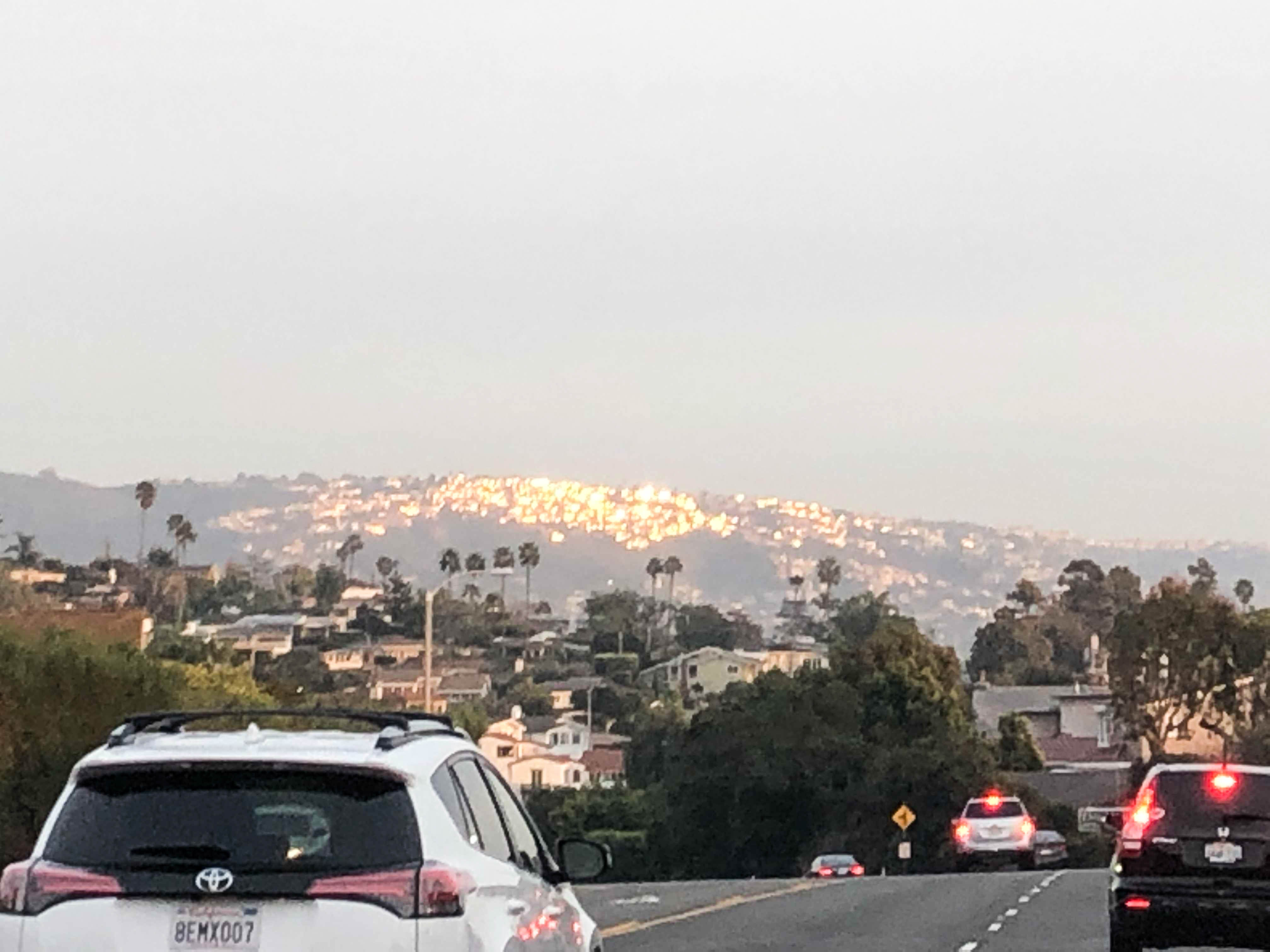 houses getting hit with direct sunlight during sunset in Laguna Beach