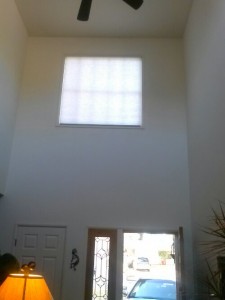 motorized cell shade in the front of the house living room